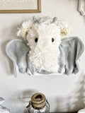 A plush Dragon Wall Mount handmade by ClaraLoo in a fantasy themed nursery. This plush dragon is made of ivory white faux fur with wings made of gray flannel fabric.